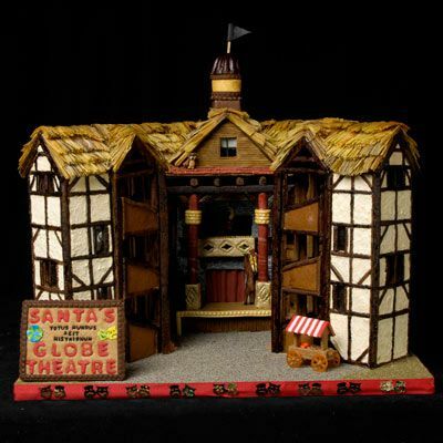 Et fantastisk honningkagehus i form af Shakespeares globeteater med et skilt foran, der siger " Julemandens globeteater."