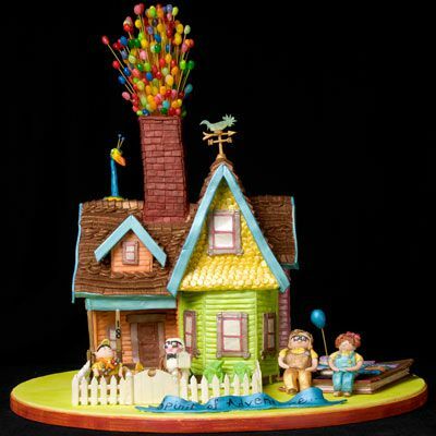 Наградена къща от меденки с многоцветни балони, направени от желе, стърчащи от комина.